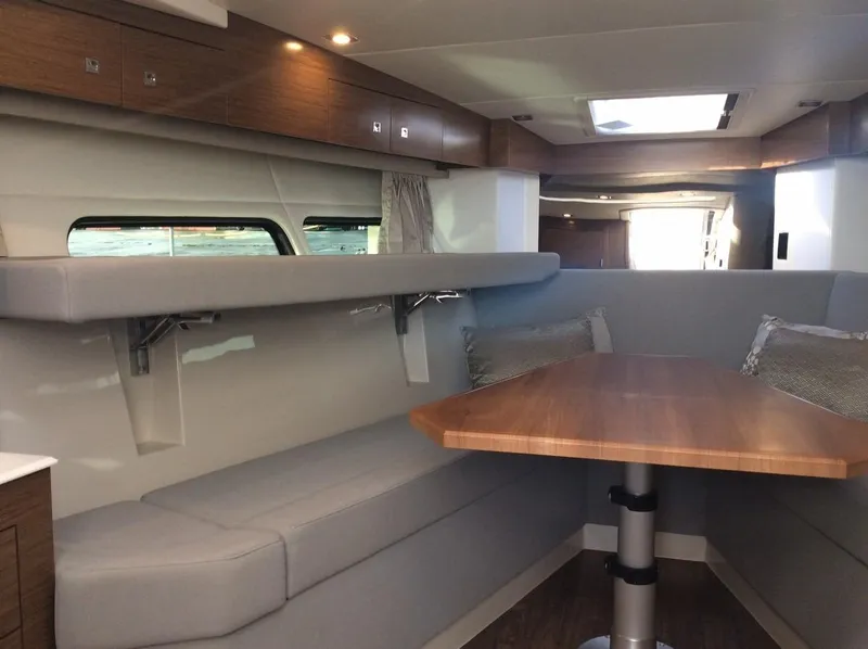 Slide: The Image of Interior of 2020 Cruisers Yachts 390 Express Coupe with dining area. - 22