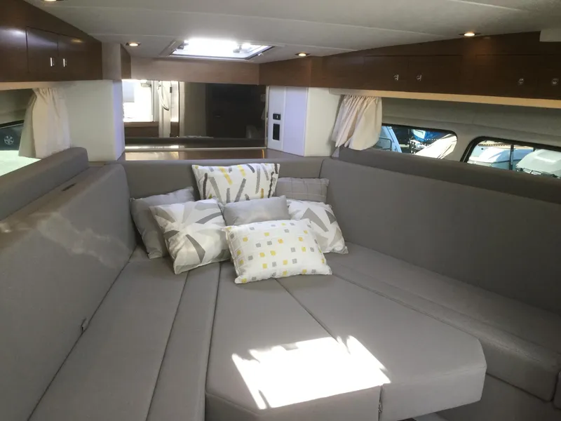 Slide: The Image of Interior of 2020 Cruisers Yachts 390 Express Coupe with gray upholstery. - 23