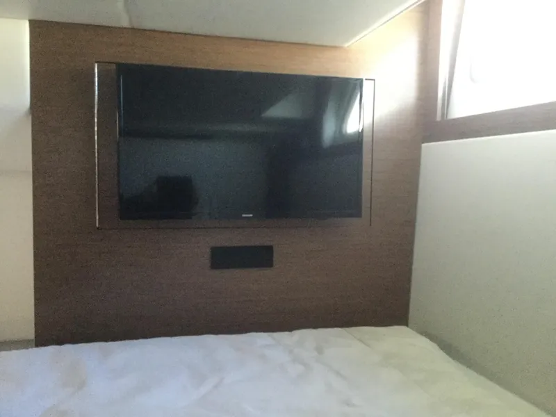Slide: The Image of Interior of 2020 Cruisers Yachts 390 Express Coupe with wall-mounted TV. - 27