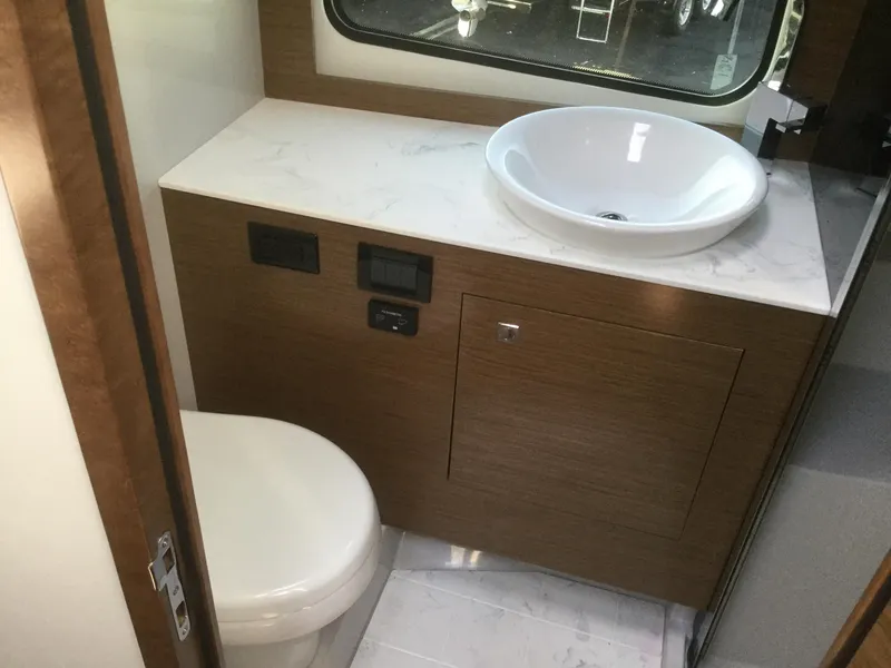 Slide: The Image of Luxury bathroom in 2020 Cruisers Yachts 390 Express Coupe. - 28
