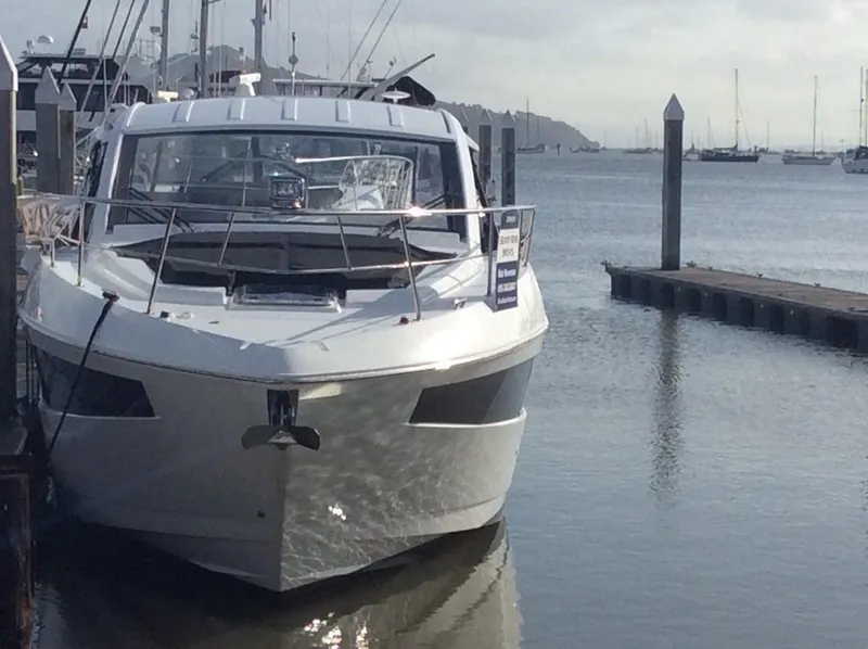 Slide: The Image of 2020 Cruisers Yachts 390 Express Coupe docked at marina. - 3