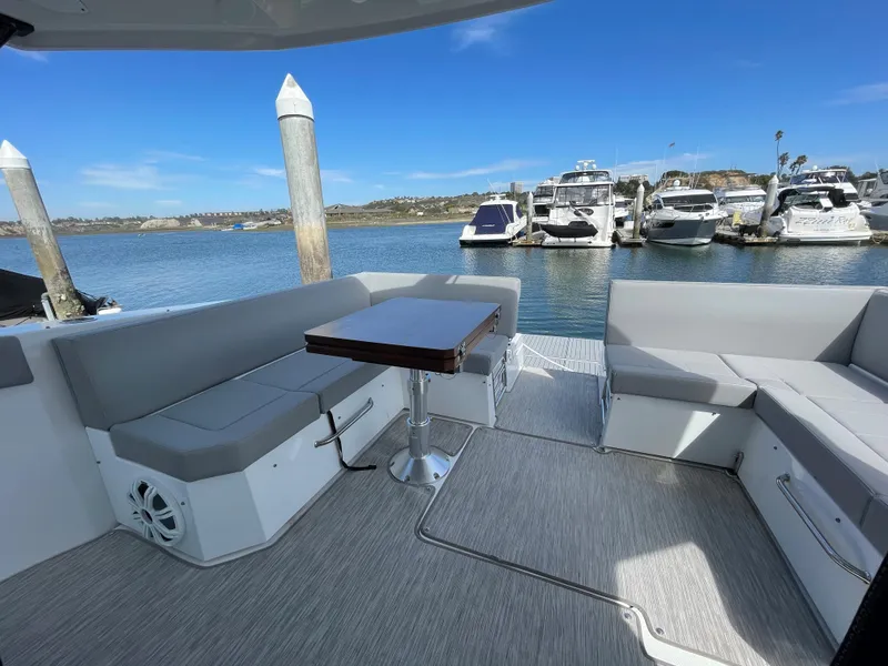 Slide: The Image of Cruisers Yachts 390 Express Coupe 2020 at dock with seating area. - 8