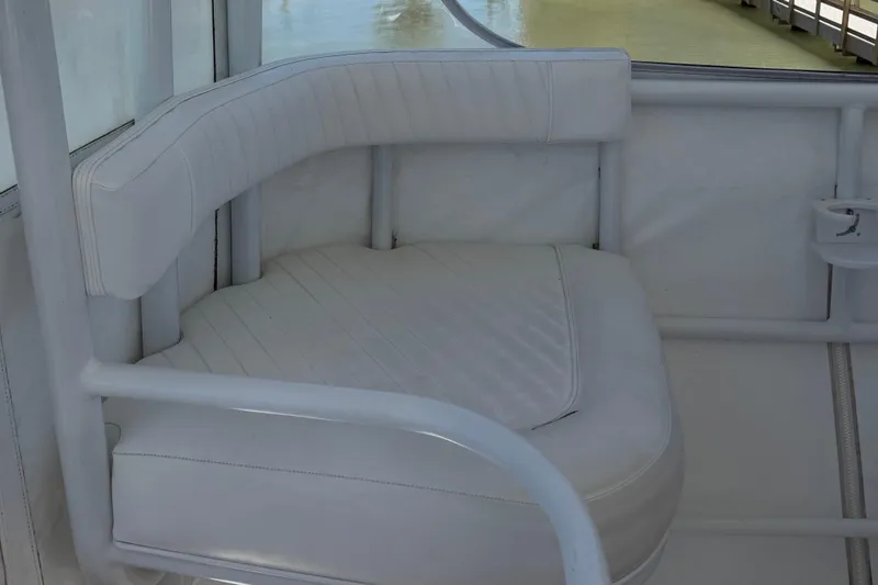 Slide: The Image of White cushioned seating on 2008 Luhrs 35 Convertible boat, featuring sleek design and comfort. - 10