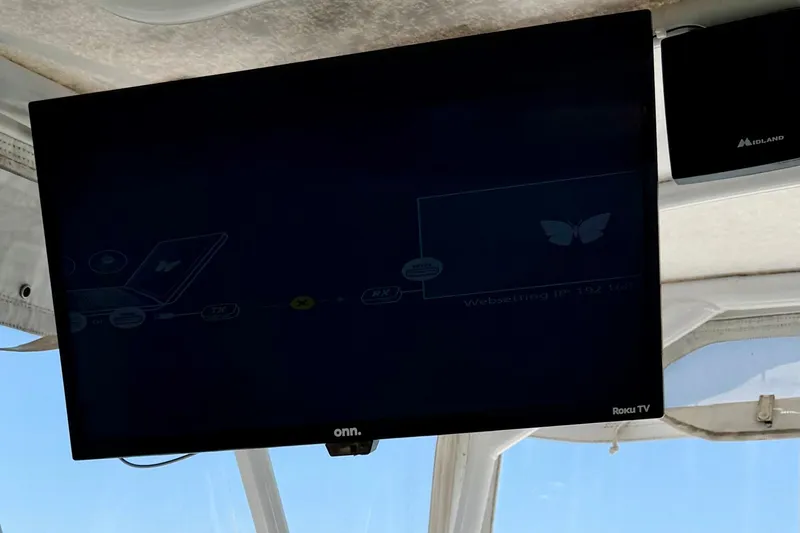 Slide: The Image of Onn Roku TV mounted on a 2008 Luhrs 35 Convertible boat. - 12