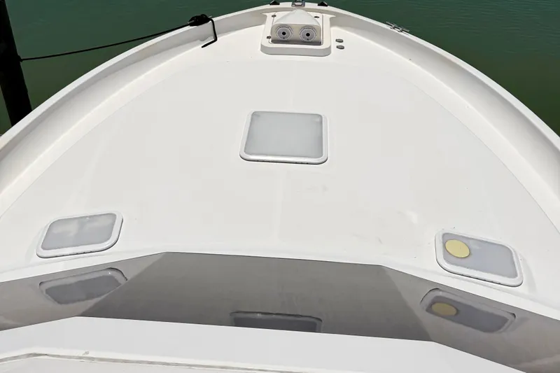 Slide: The Image of Bow view of 2008 Luhrs 35 Convertible boat with hatches and fittings. - 14