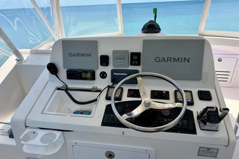 Slide: The Image of Helm of 2008 Luhrs 35 Convertible boat with Garmin navigation system. - 16