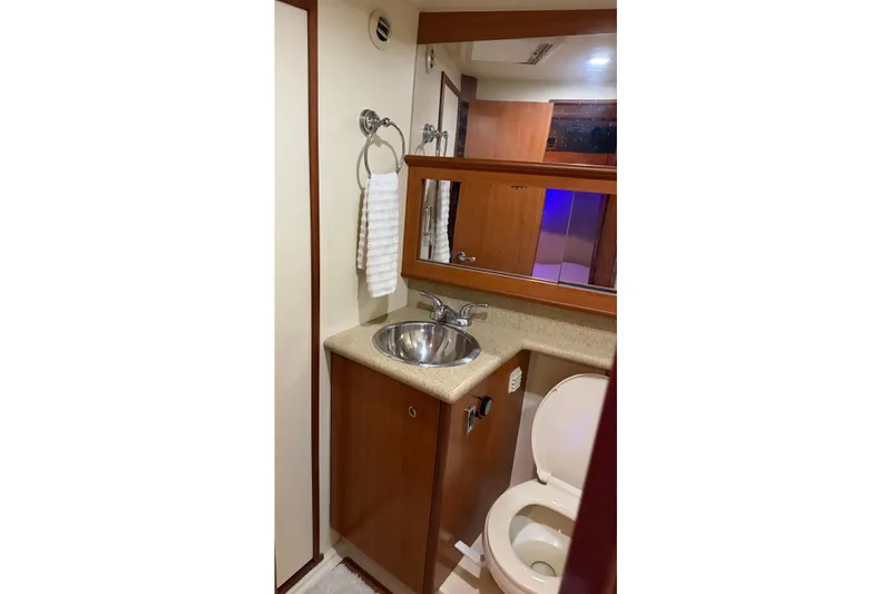 Slide: The Image of Bathroom interior of 2008 Luhrs 35 Convertible yacht with sink and toilet. - 23