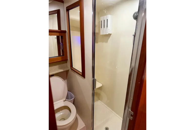 Slide: The Image of Bathroom interior of 2008 Luhrs 35 Convertible yacht with shower and toilet. - 24