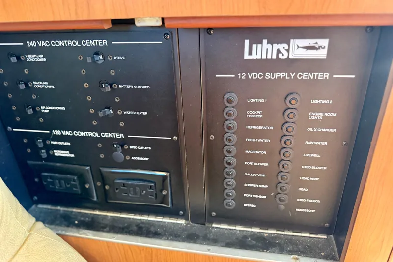 Slide: The Image of Luhrs 35 Convertible 2008 control panel with 240 VAC and 12 VDC supply centers. - 27