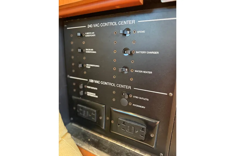 Slide: The Image of Electrical control panel on a 2008 Luhrs 35 Convertible boat, featuring various switches and outlets. - 29