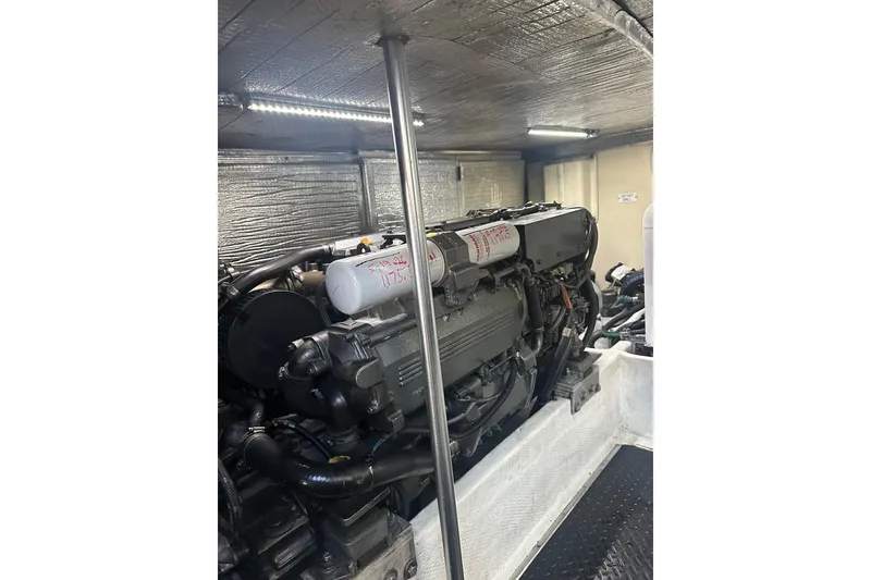 Slide: The Image of Engine room of 2008 Luhrs 36 Convertible boat, showcasing powerful machinery. - 4