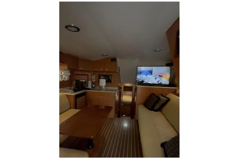 Slide: The Image of Interior of 2008 Luhrs 36 Convertible yacht with cozy seating and modern amenities. - 6
