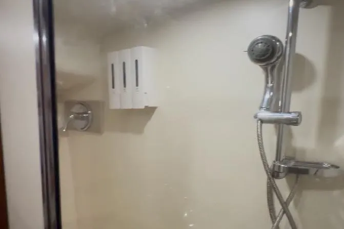 Slide: The Image of Shower area in 2008 Luhrs 36 Convertible yacht with chrome fixtures and dispensers. - 9