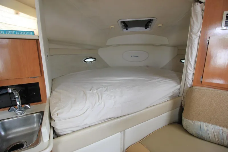 Slide: The Image of Interior cabin of 2001 Bayliner 3055 Ciera with bed, sink, and seating area. - 15