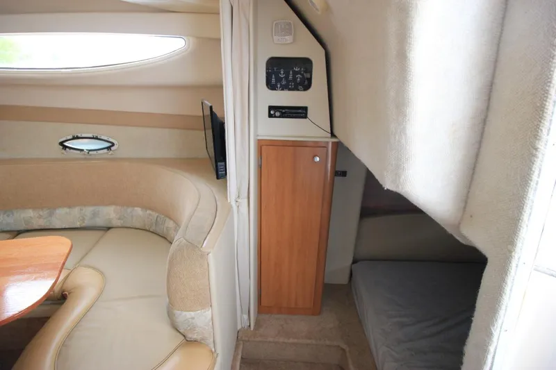 Slide: The Image of Interior of 2001 Bayliner 3055 Ciera boat with cozy seating and compact cabin space. - 22