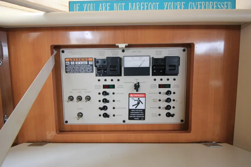 Slide: The Image of Electrical control panel on a 2001 Bayliner 3055 Ciera boat interior. - 24