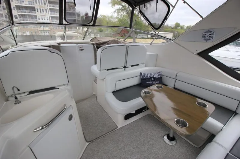 Slide: The Image of Interior of 2001 Bayliner 3055 Ciera boat with seating and table. - 7