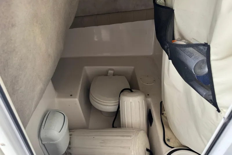 Slide: The Image of Interior of 2018 Sea Fox 249 Avenger boat with toilet and storage compartments. - 11