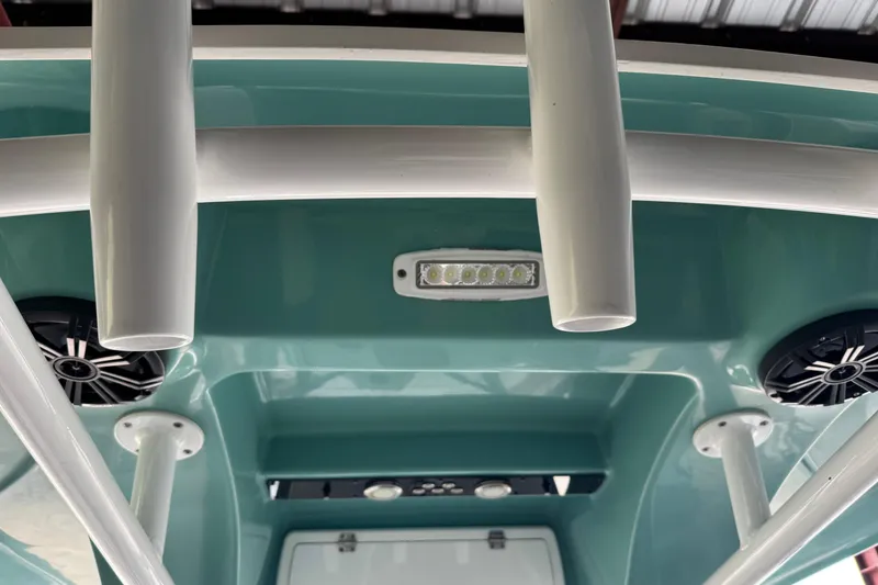 Slide: The Image of 2018 Sea Fox 249 Avenger boat interior with speakers and rod holders. - 9