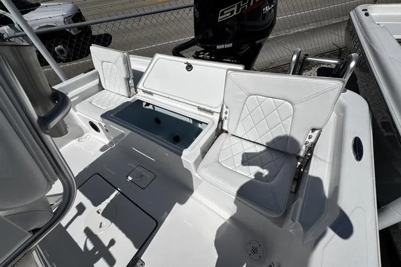 Slide: The Image of 2026 Blazer Bay 2200 boat interior with cushioned seating and storage compartments. - 22