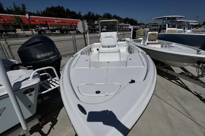 Slide: The Image of 2026 Blazer Bay 2200 boat with Yamaha engine, displayed outdoors on a sunny day. - 5