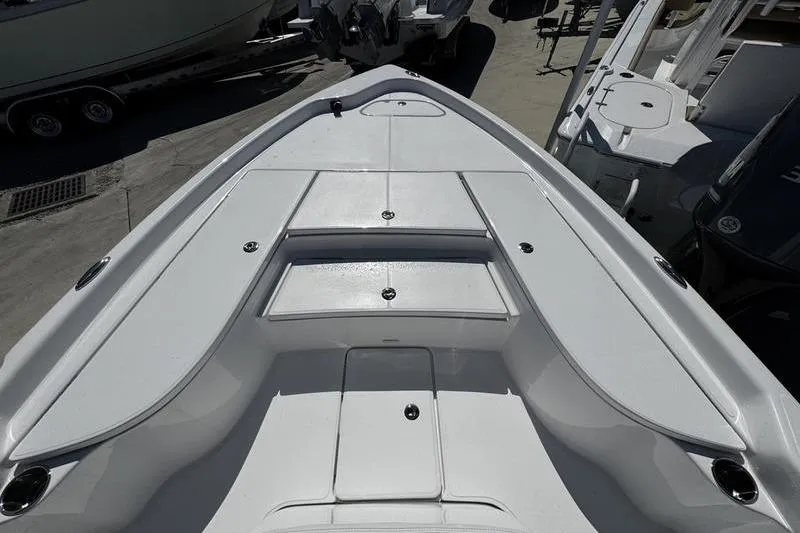 Slide: The Image of 2026 Blazer Bay 2200 boat deck with storage compartments and sleek design. - 6