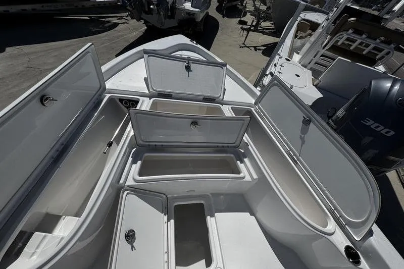 Slide: The Image of Open storage compartments on a 2026 Blazer Bay 2200 boat deck. - 9