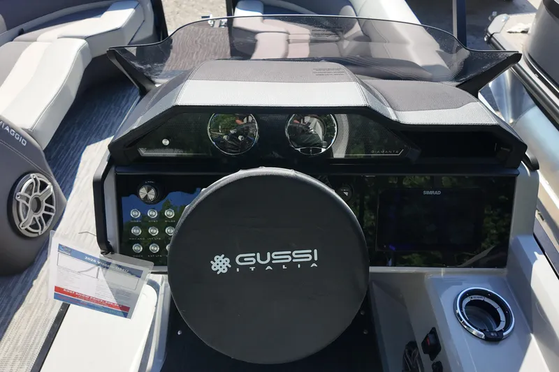 Slide: The Image of 2026 Viaggio Diamante U 22 boat dashboard with Gussi Italia steering wheel and Simrad display. - 9