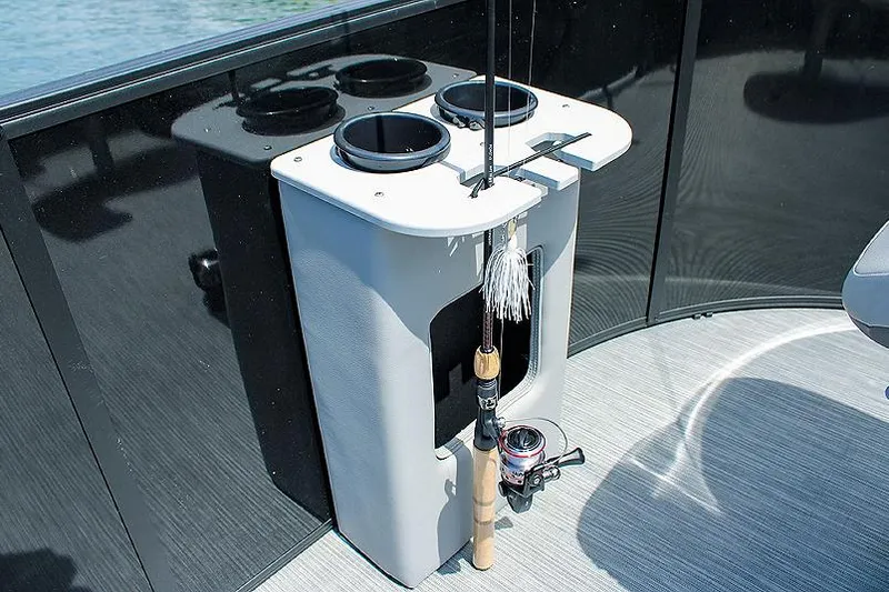 Slide: The Image of Manufacturer Provided Image: Fishing rod holder on Lowe LF 172 boat, 2025 model, with cup holders and storage. - 3