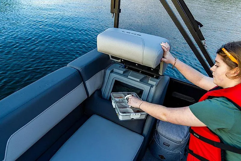 Slide: The Image of Manufacturer Provided Image: Person accessing storage on 2025 Lowe LF 172 boat, near water. - 4