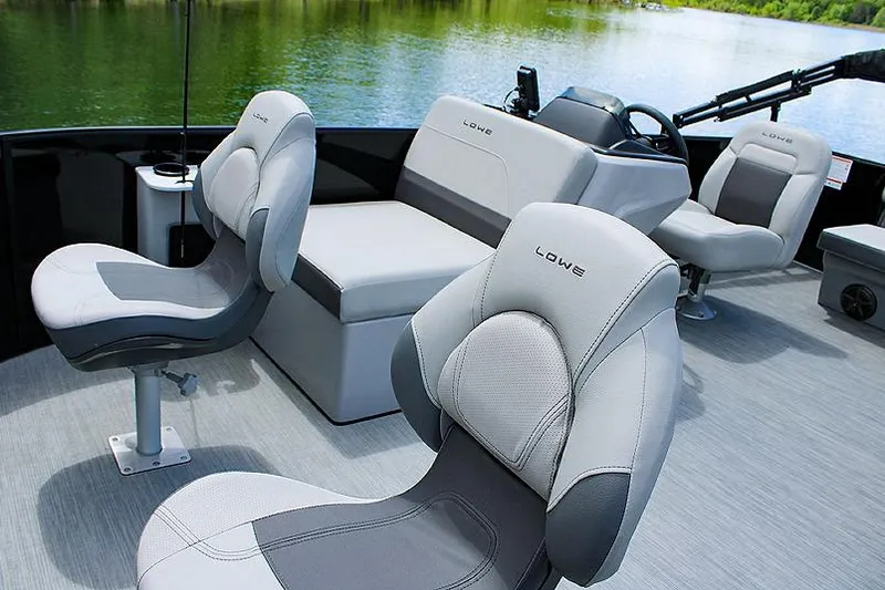 Slide: The Image of Manufacturer Provided Image: 2025 Lowe LF 172 boat interior with comfortable seating on a serene lake. - 5