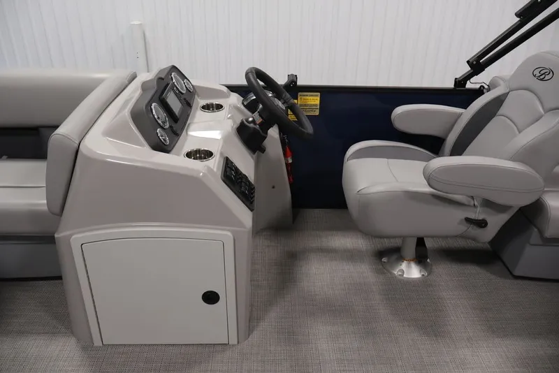 Slide: The Image of 2026 Bentley Pontoons 200 LE CW helm with steering wheel and comfortable captain's chair. - 16