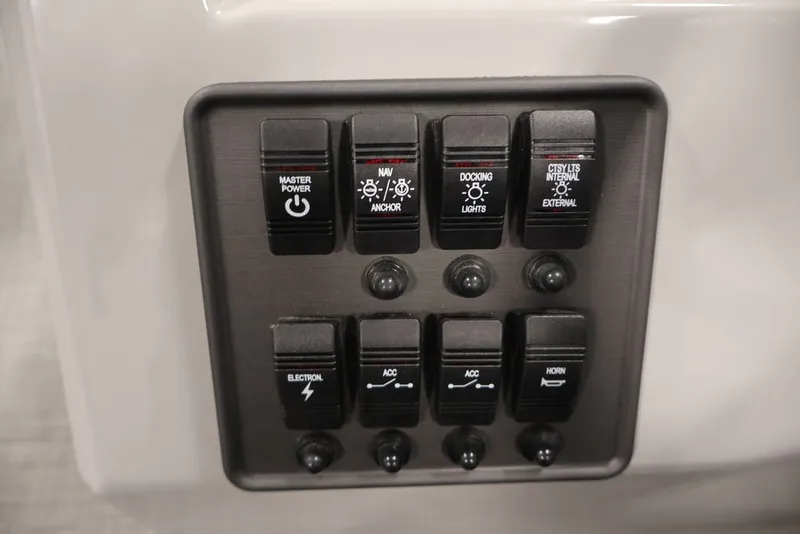 Slide: The Image of Control panel of 2026 Bentley Pontoons 200 LE CW with various switches. - 27