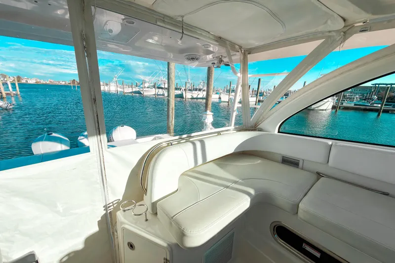 Slide: The Image of Interior view of 2021 Pursuit OS 385 Offshore yacht with marina backdrop. - 29