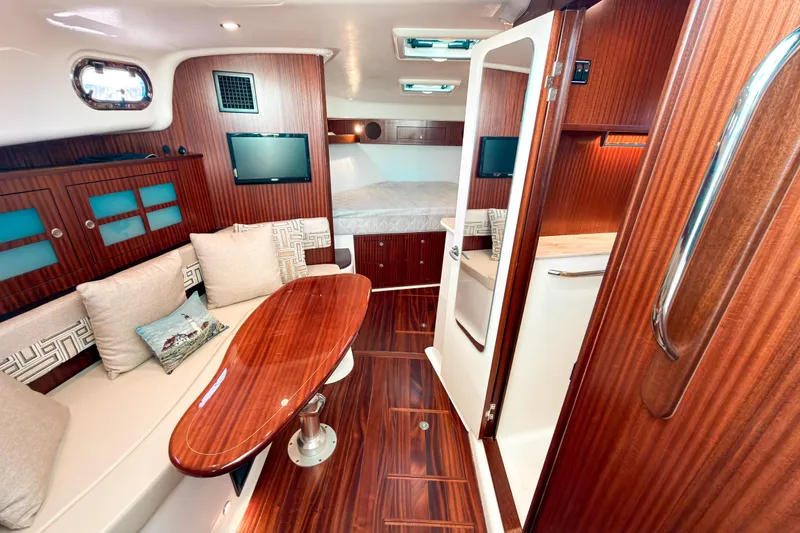 Slide: The Image of Luxurious interior of 2021 Pursuit OS 385 Offshore yacht with elegant wood finishes. - 40