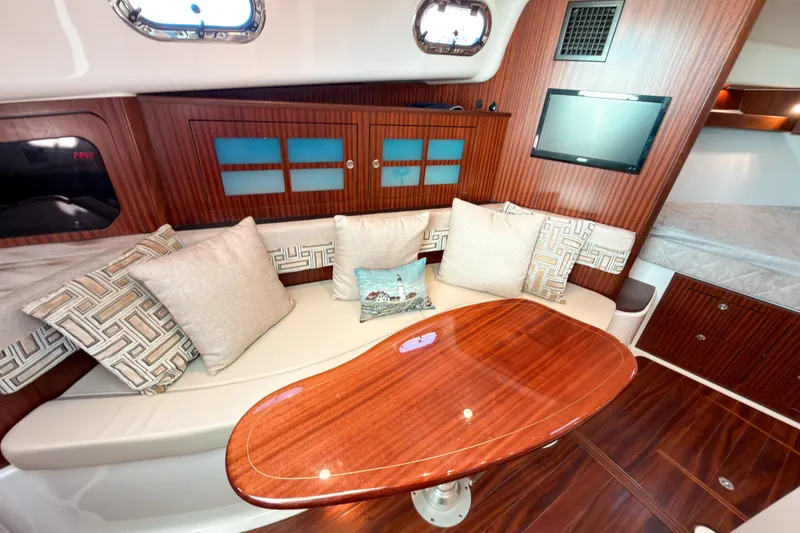 Slide: The Image of Luxurious interior of 2021 Pursuit OS 385 Offshore yacht with elegant wood finishes. - 41
