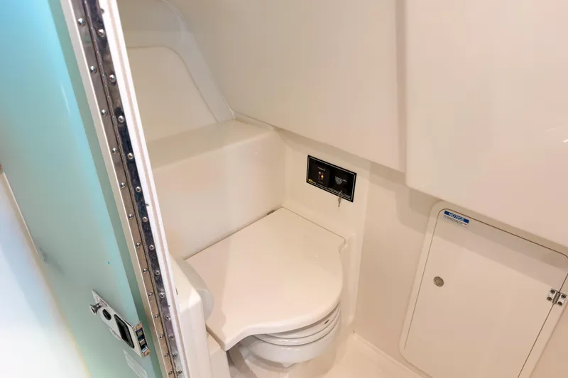 Slide: The Image of 2021 Pursuit OS 385 Offshore boat bathroom interior with modern fixtures. - 50