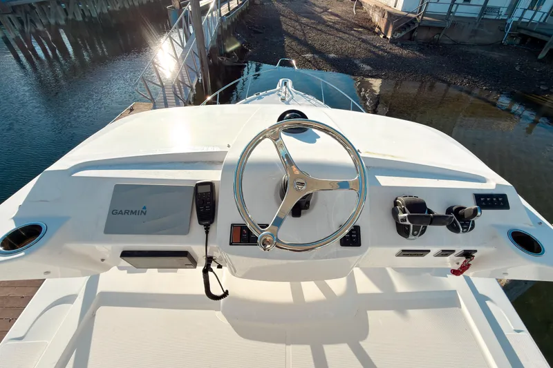 Slide: The Image of Helm of 2021 Pursuit OS 385 Offshore boat with Garmin navigation system. - 57