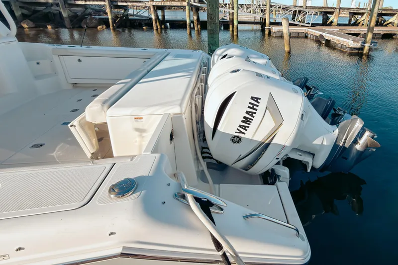 Slide: The Image of 2021 Pursuit OS 385 Offshore boat with Yamaha outboard engines docked at marina. - 6
