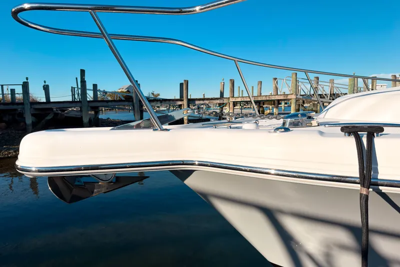 Slide: The Image of 2021 Pursuit OS 385 Offshore boat docked at marina under clear blue sky. - 64