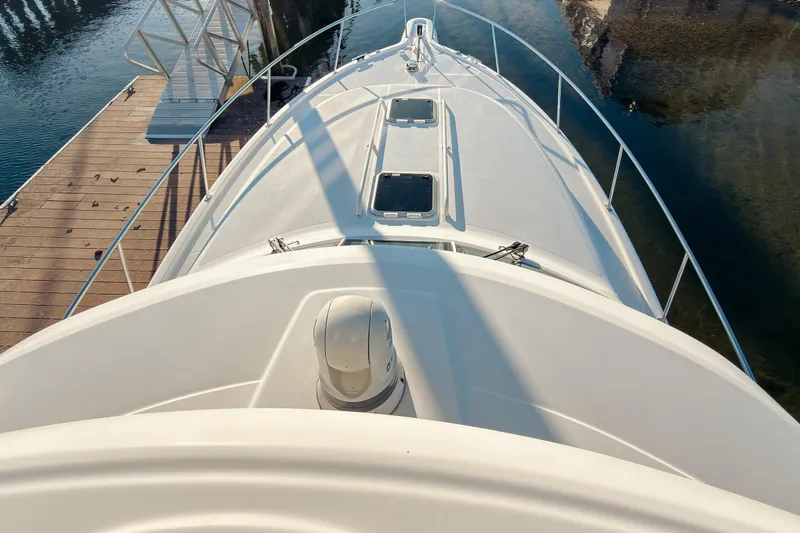 Slide: The Image of 2021 Pursuit OS 385 Offshore boat docked, viewed from above, showcasing sleek design. - 69