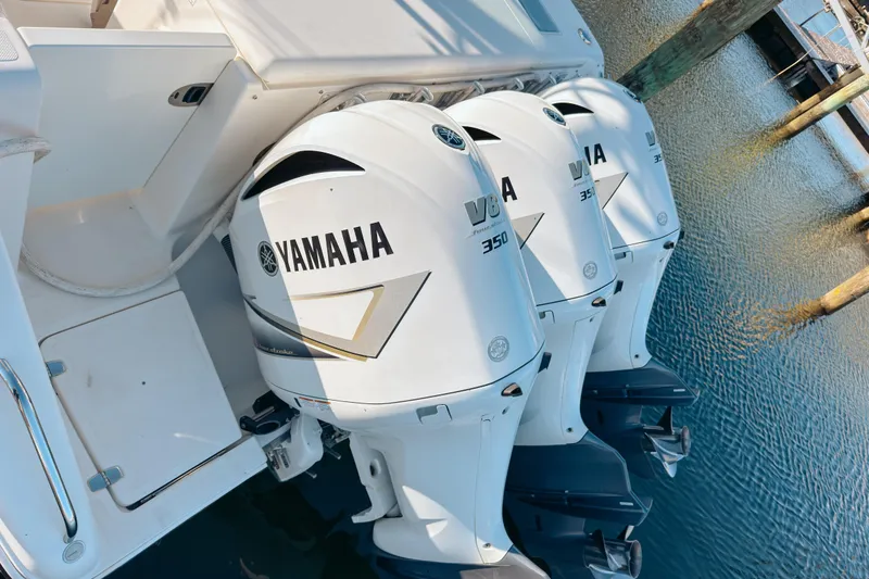 Slide: The Image of Triple Yamaha V8 350 outboard engines on a 2021 Pursuit OS 385 Offshore boat. - 7