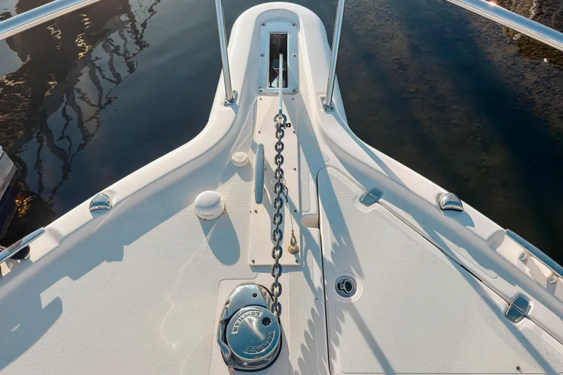 Slide: The Image of Bow view of 2021 Pursuit OS 385 Offshore boat with anchor chain and deck details. - 74