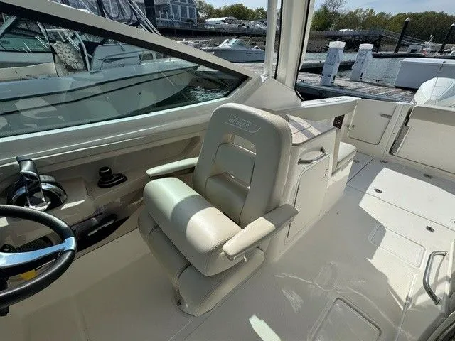 Slide: The Image of Interior of 2022 Boston Whaler 280 Vantage boat, helm and seating area. - 15