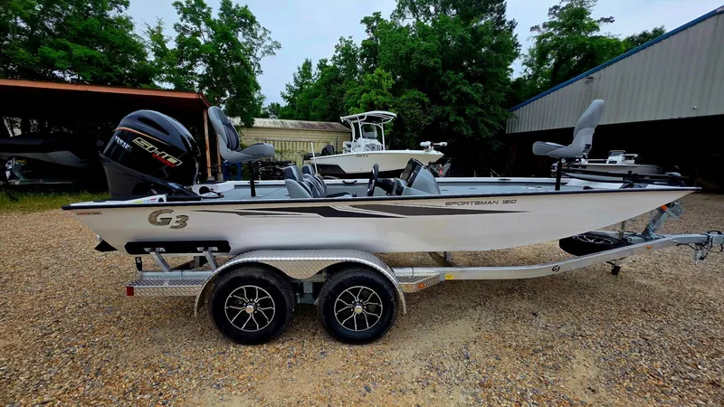 The Image of 2026 G3 Sportsman 1910 boat on trailer, parked outdoors. - 1