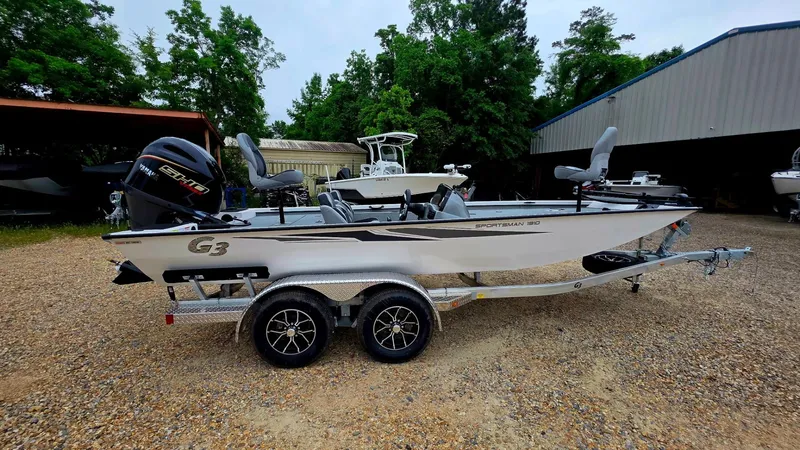 Slide: The Image of 2026 G3 Sportsman 1910 boat parked on trailer outdoors. - 7