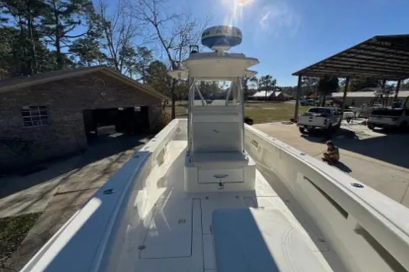 Slide: The Image of 2019 SeaVee 320B boat docked outdoors under clear blue sky. - 11