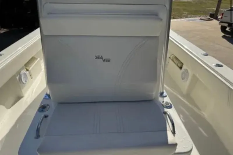 Slide: The Image of 2019 SeaVee 320B boat seat with logo, featuring white upholstery and stainless steel handles. - 13