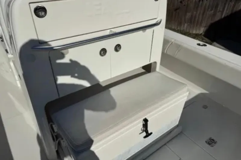 Slide: The Image of 2019 SeaVee 320B boat interior with storage compartment and seating. - 15