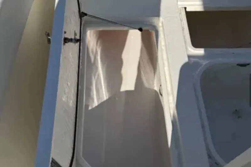 Slide: The Image of Open storage compartment on a 2019 SeaVee 320B boat. - 16